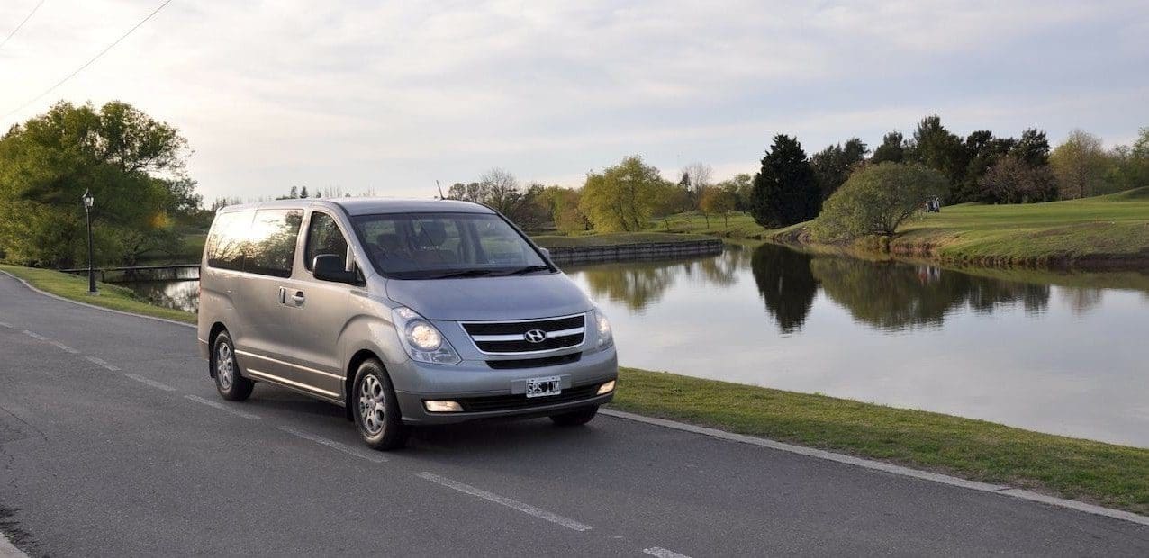 7 Seater minivan parking next to lake