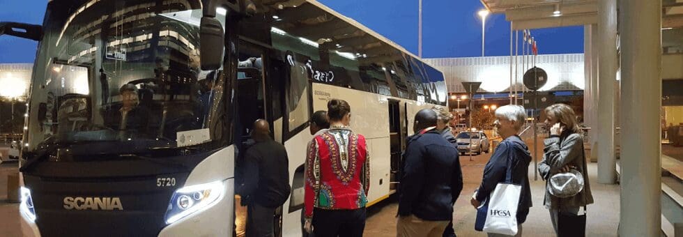 Passengers Boarding a Shuttle Bus for Conference