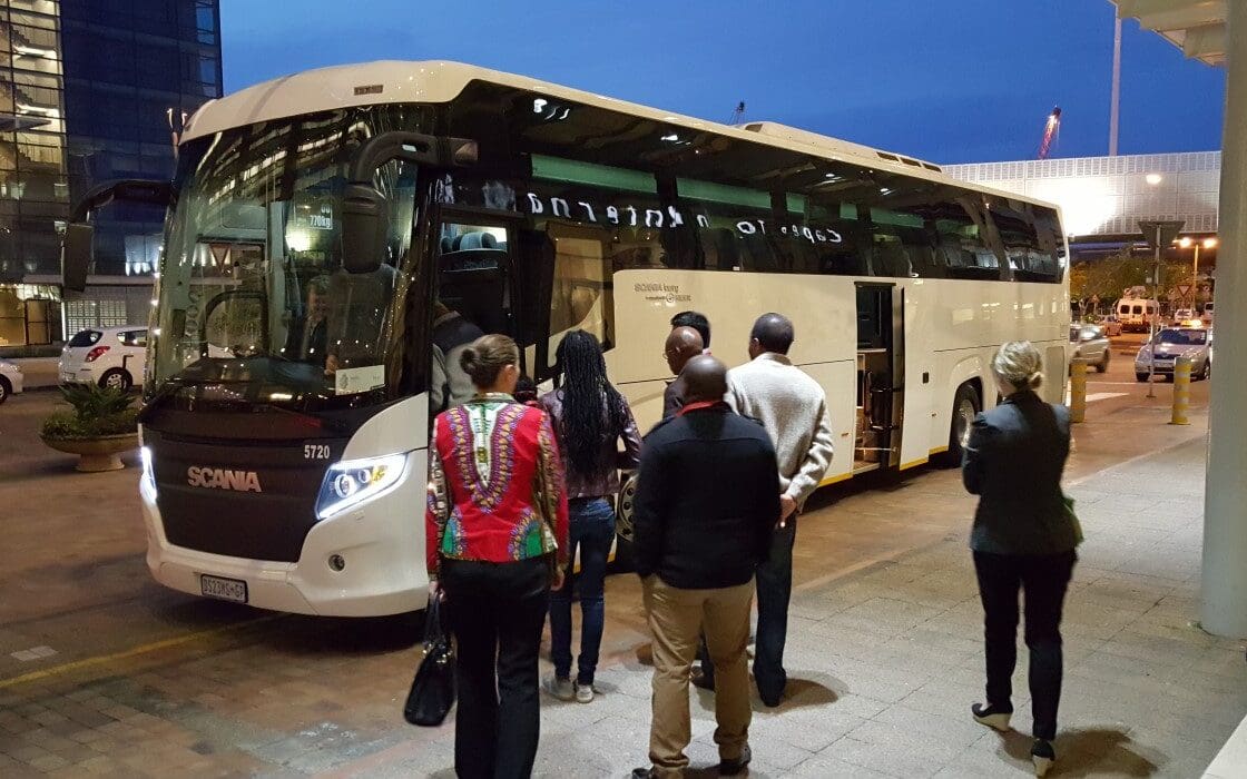 Conference Delegates boarding a luxury coach to shuttle to their Dinner