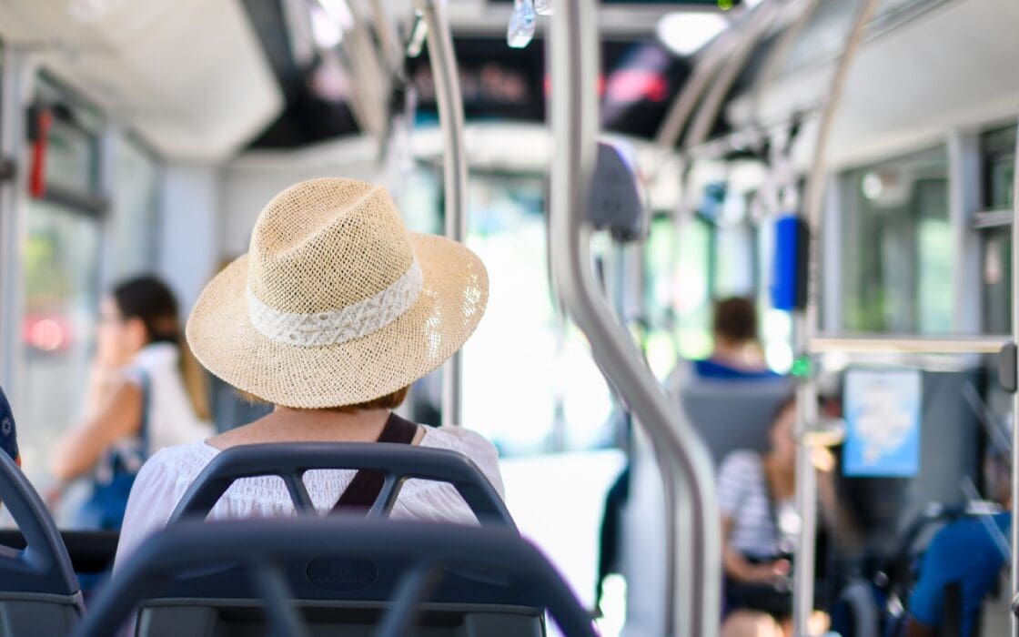 Woman seated in busy commuter bus in Johannesburg