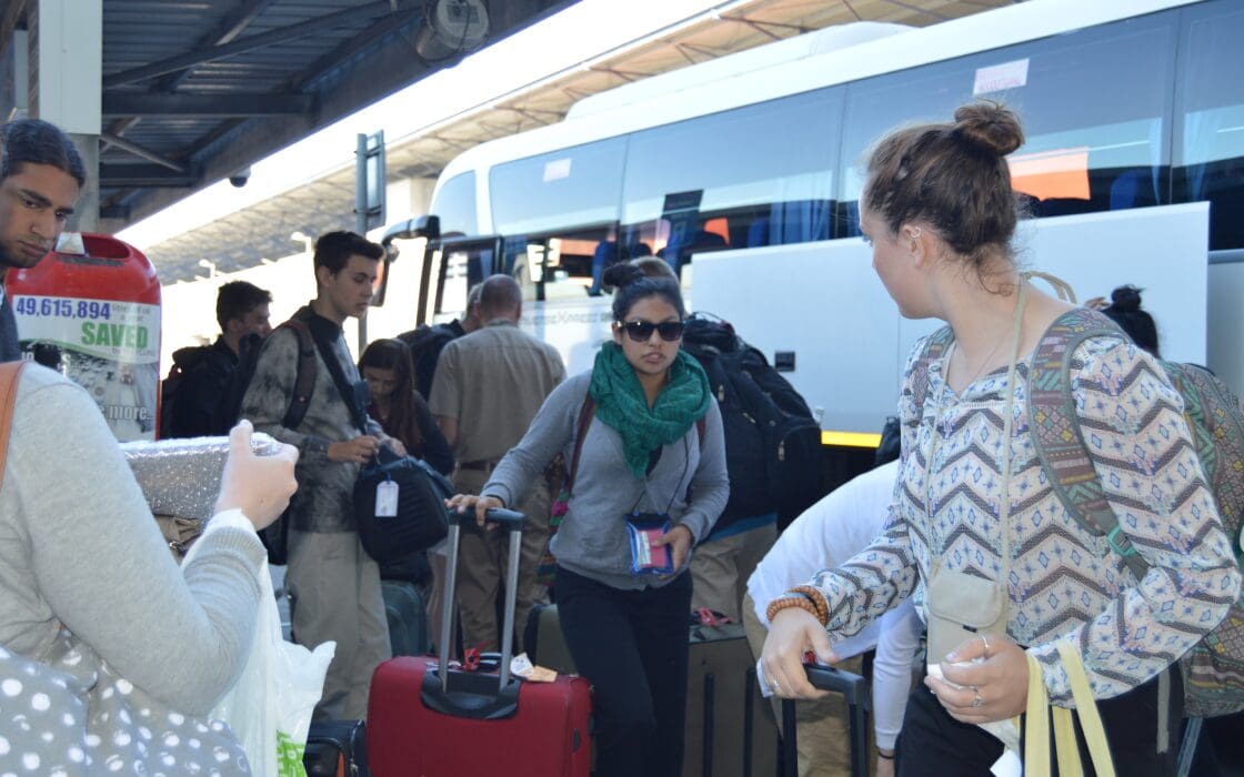 Tour Group at Cape Town International Airport collecting luggage from the luxury tour coach.